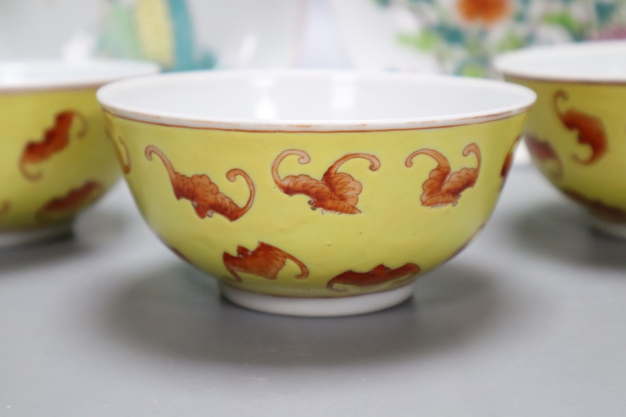 Two Chinese famille rose saucer, dishes and three yellow ground bat bowls, largest diameter 18.5cm